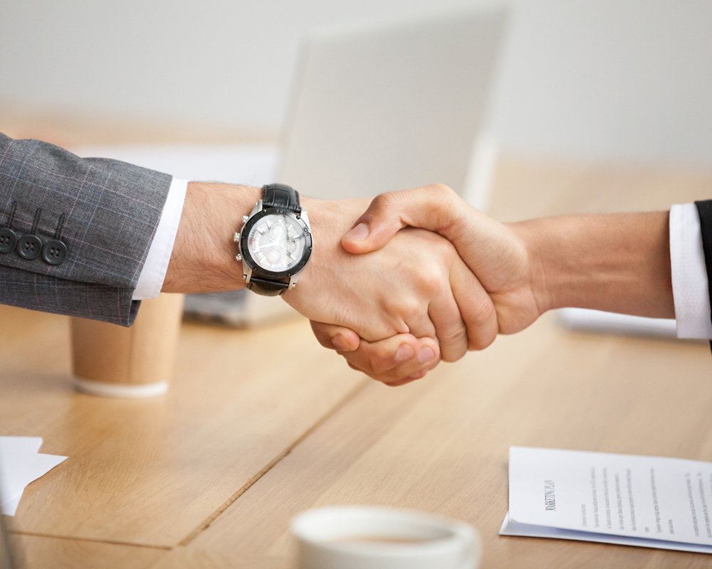 closeup-view-handshake-two-businessmen-suits-shaking-hands